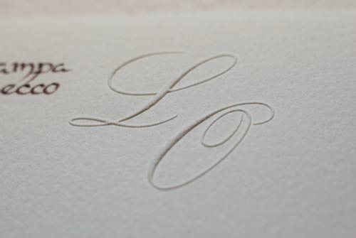 Close-up of the embossed initials